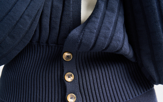 Close up of Birdie & Claire Jaqueline Sweater in Navy Ecoviscose Fabric. 